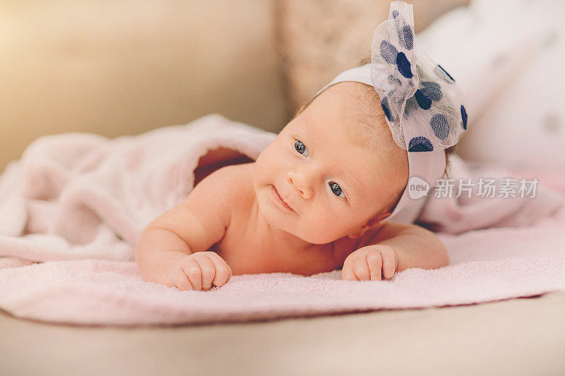 Newborn baby girl with blue eyes